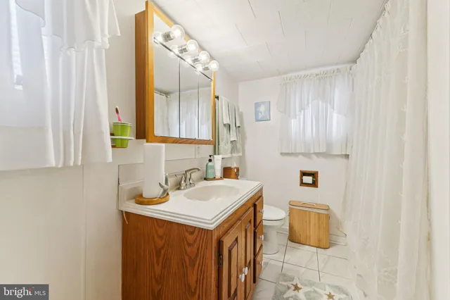 a utility room with a sink dryer and washer