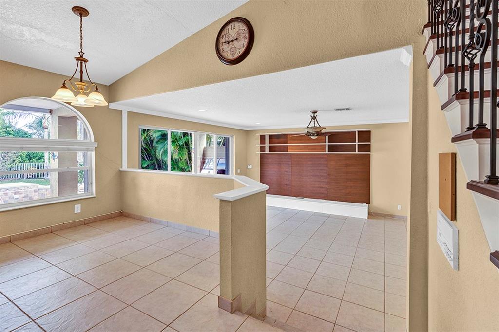 19571 Black Olive Lane Boca Raton, FL 33498 - Photo 13 of 61 a view of a kitchen with a fridge and a window