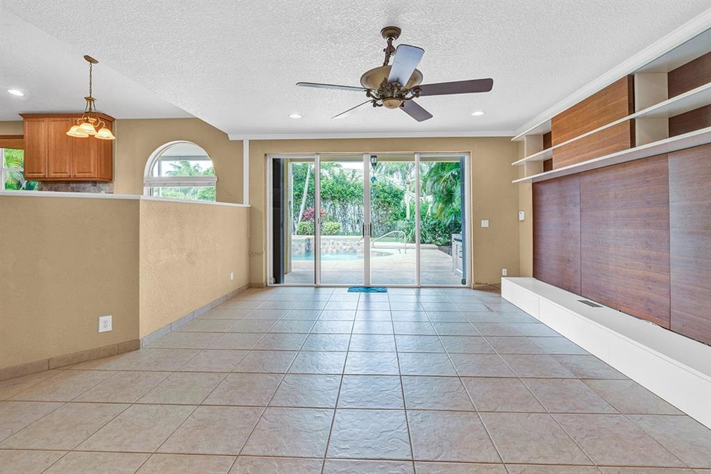 19571 Black Olive Lane Boca Raton, FL 33498 - Photo 15 of 61 a view of a livingroom with a ceiling fan and window