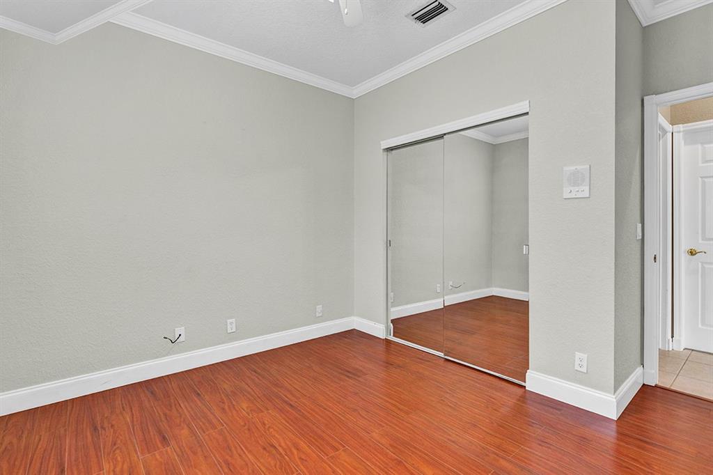 19571 Black Olive Lane Boca Raton, FL 33498 - Photo 20 of 61 an empty room with wooden floor