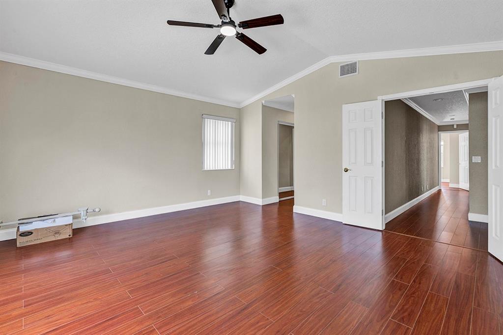 19571 Black Olive Lane Boca Raton, FL 33498 - Photo 24 of 61 a view of empty room with wooden floor and window