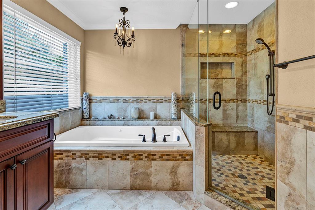 19571 Black Olive Lane Boca Raton, FL 33498 - Photo 27 of 61 a bathroom with a bathtub and shower