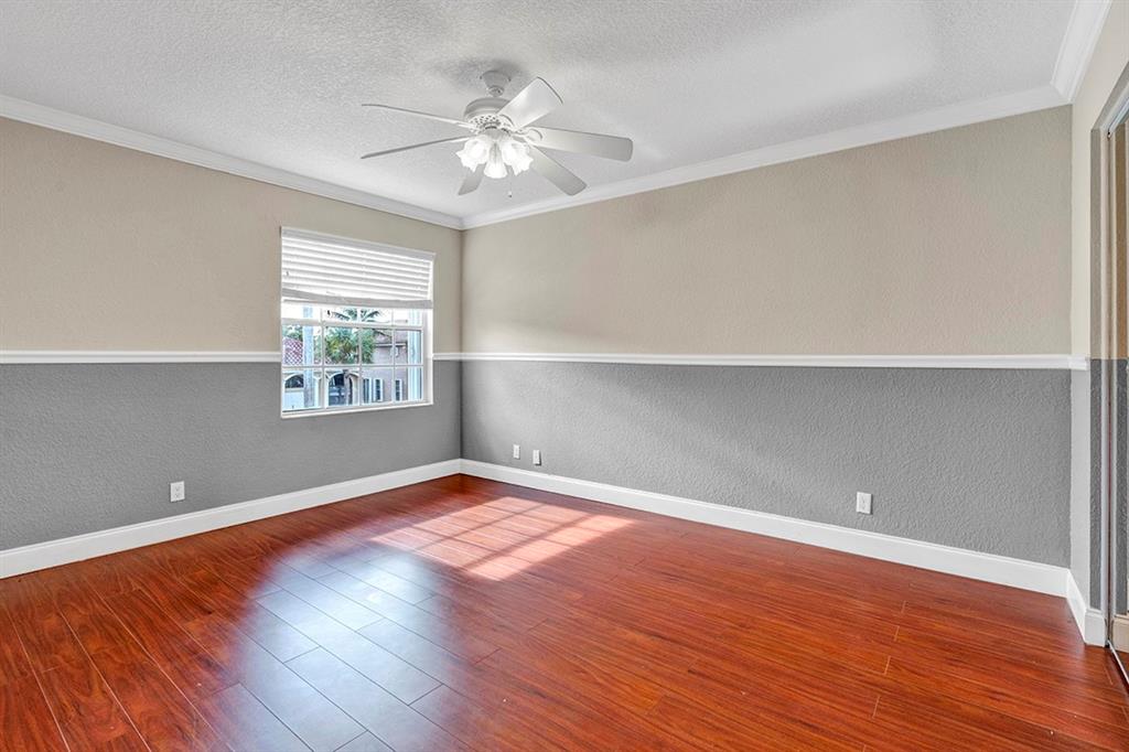 19571 Black Olive Lane Boca Raton, FL 33498 - Photo 34 of 61 a view of an empty room with wooden floor and a window