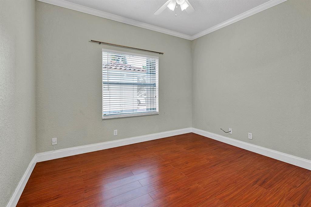 19571 Black Olive Lane Boca Raton, FL 33498 - Photo 35 of 61 an empty room with wooden floor and windows