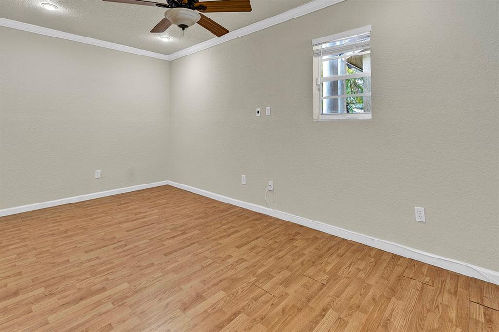 19571 Black Olive Lane Boca Raton, FL 33498 - Photo 37 of 61 wooden floor in an empty room with a window