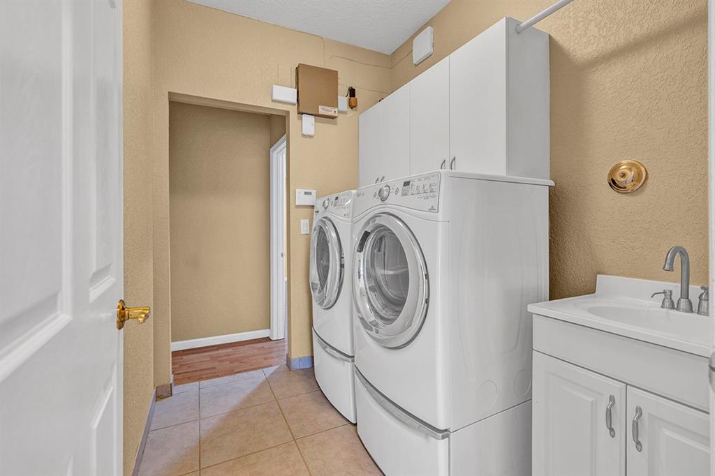 19571 Black Olive Lane Boca Raton, FL 33498 - Photo 41 of 61 a utility room with dryer and washer
