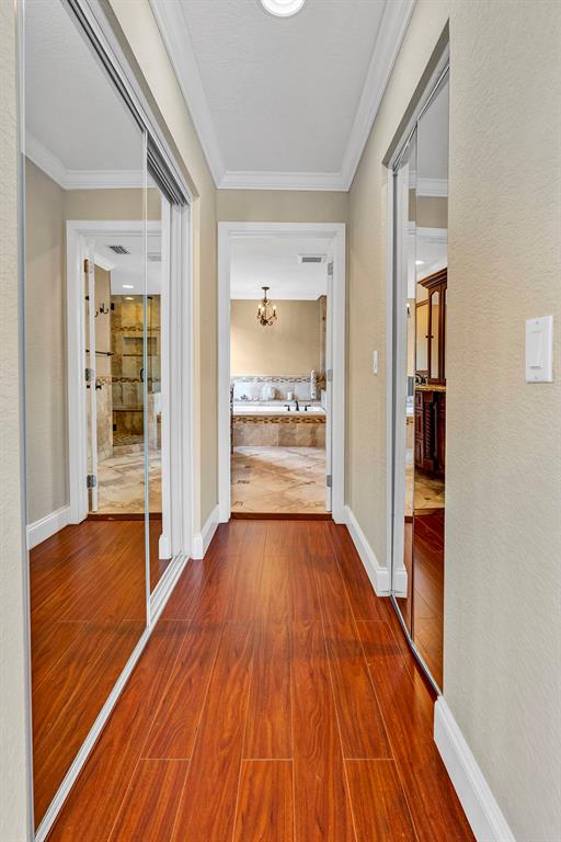 19571 Black Olive Lane Boca Raton, FL 33498 - Photo 42 of 61 a view of an empty room with wooden floor and a window