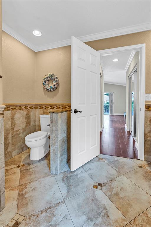 19571 Black Olive Lane Boca Raton, FL 33498 - Photo 44 of 61 a bathroom with a toilet sink and shower