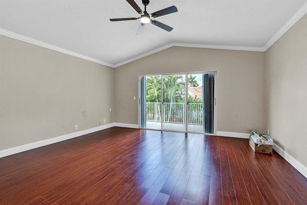 19571 Black Olive Lane Boca Raton, FL 33498 - Photo 46 of 61 an empty room with wooden floor and windows