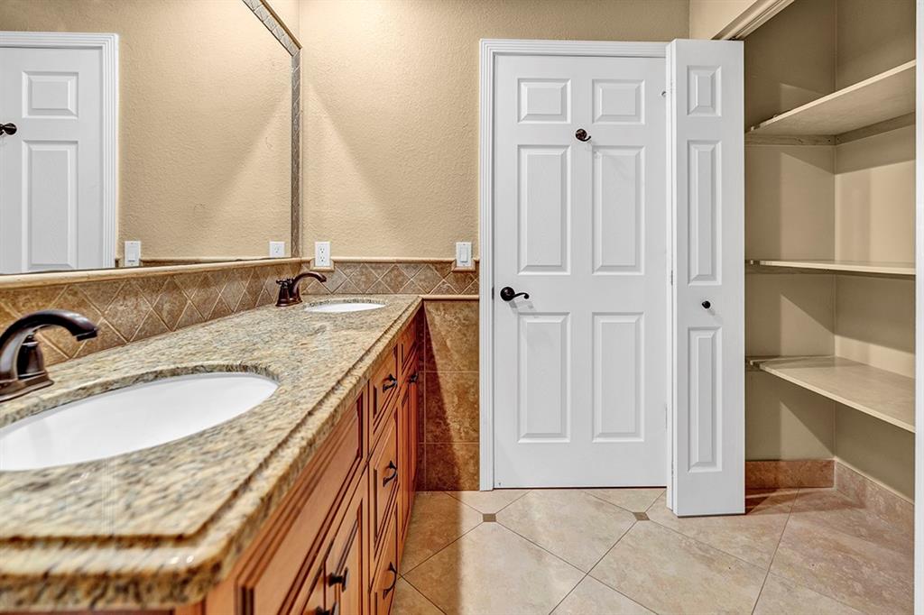 19571 Black Olive Lane Boca Raton, FL 33498 - Photo 47 of 61 a bathroom with a granite countertop sink and a mirror