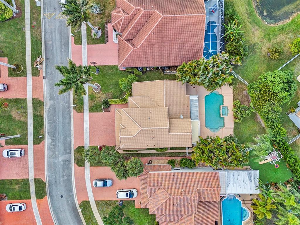 19571 Black Olive Lane Boca Raton, FL 33498 - Photo 51 of 61 an aerial view of a house with a yard and garden