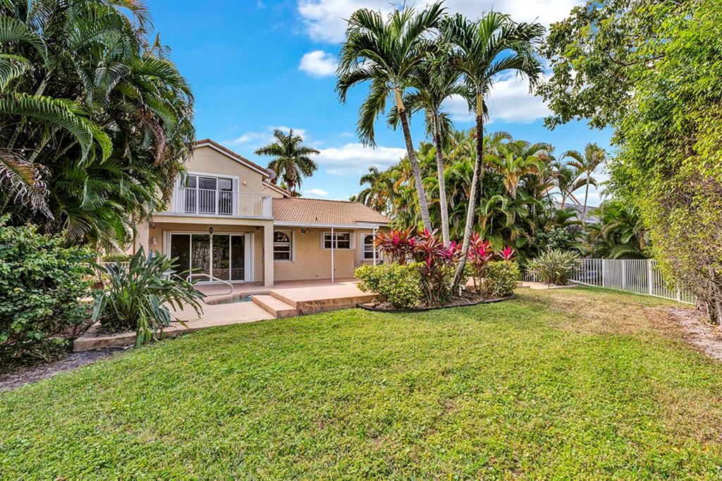 19571 Black Olive Lane Boca Raton, FL 33498 - Photo 55 of 61 a front view of house with yard and seating area