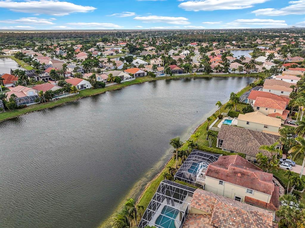 19571 Black Olive Lane Boca Raton, FL 33498 - Photo 59 of 61 an aerial view of a house with a lake view