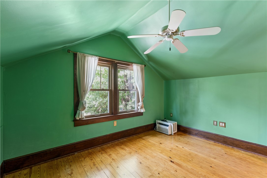 321 South Pine Street Walhalla, SC 29691 - Photo 17 of 32 Hardwood floors and a wide window brighten this cozy, green-walled room.