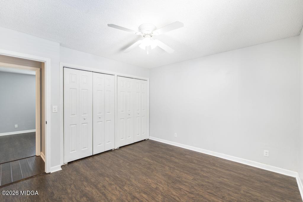 3710 Sandy Circle Macon, GA 31216 - Photo 22 of 44 a view of an empty room with wooden floor and a ceiling fan