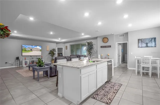 a bed room with a bed and a lamp