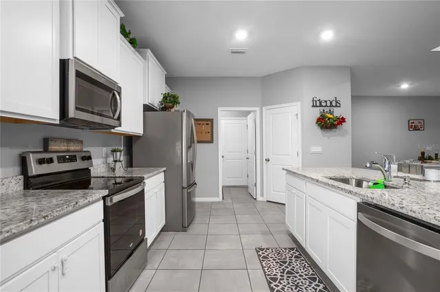 a bedroom with a bed and a table