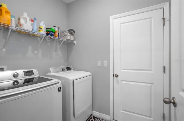 a dining room with a floor to ceiling window and an outdoor view