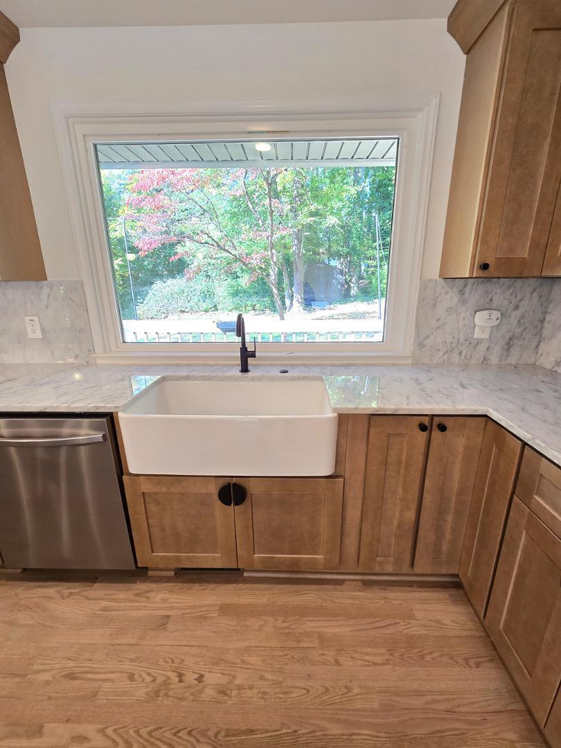 1105 Hardimont Road Raleigh, NC 27609 - Photo 11 of 61 a view of a kitchen with a sink and dishwasher