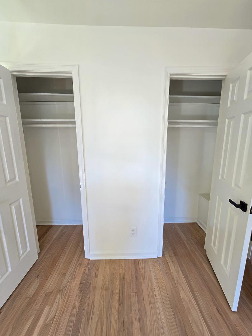 1105 Hardimont Road Raleigh, NC 27609 - Photo 28 of 61 a view of an empty room with wooden floor and a window