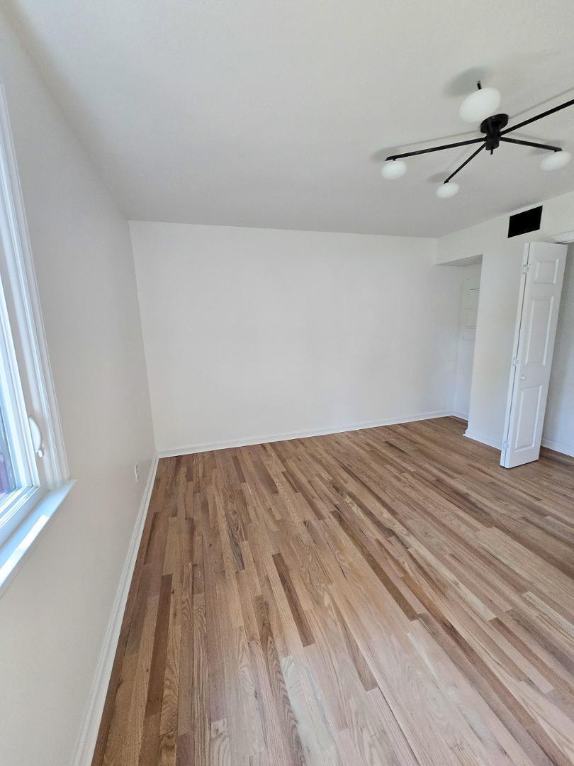 1105 Hardimont Road Raleigh, NC 27609 - Photo 47 of 61 a view of a room with wooden floor and fan