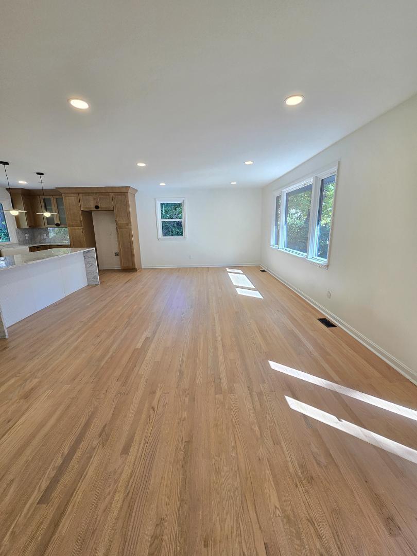 1105 Hardimont Road Raleigh, NC 27609 - Photo 5 of 61 a view of empty room with wooden floor and window