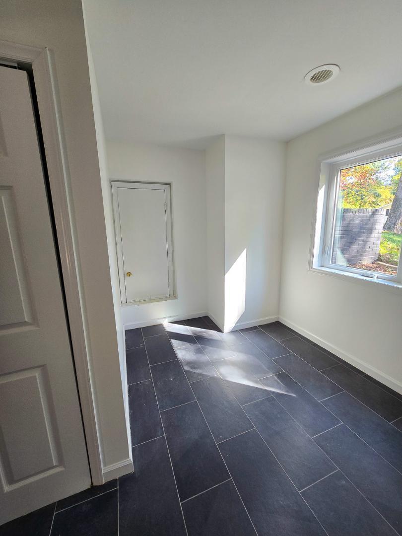 1105 Hardimont Road Raleigh, NC 27609 - Photo 51 of 61 a view of an empty room and window