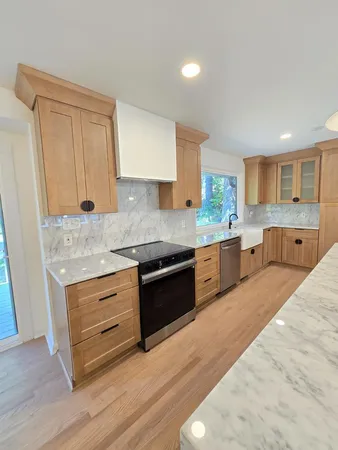 a view of a kitchen with a sink and dishwasher