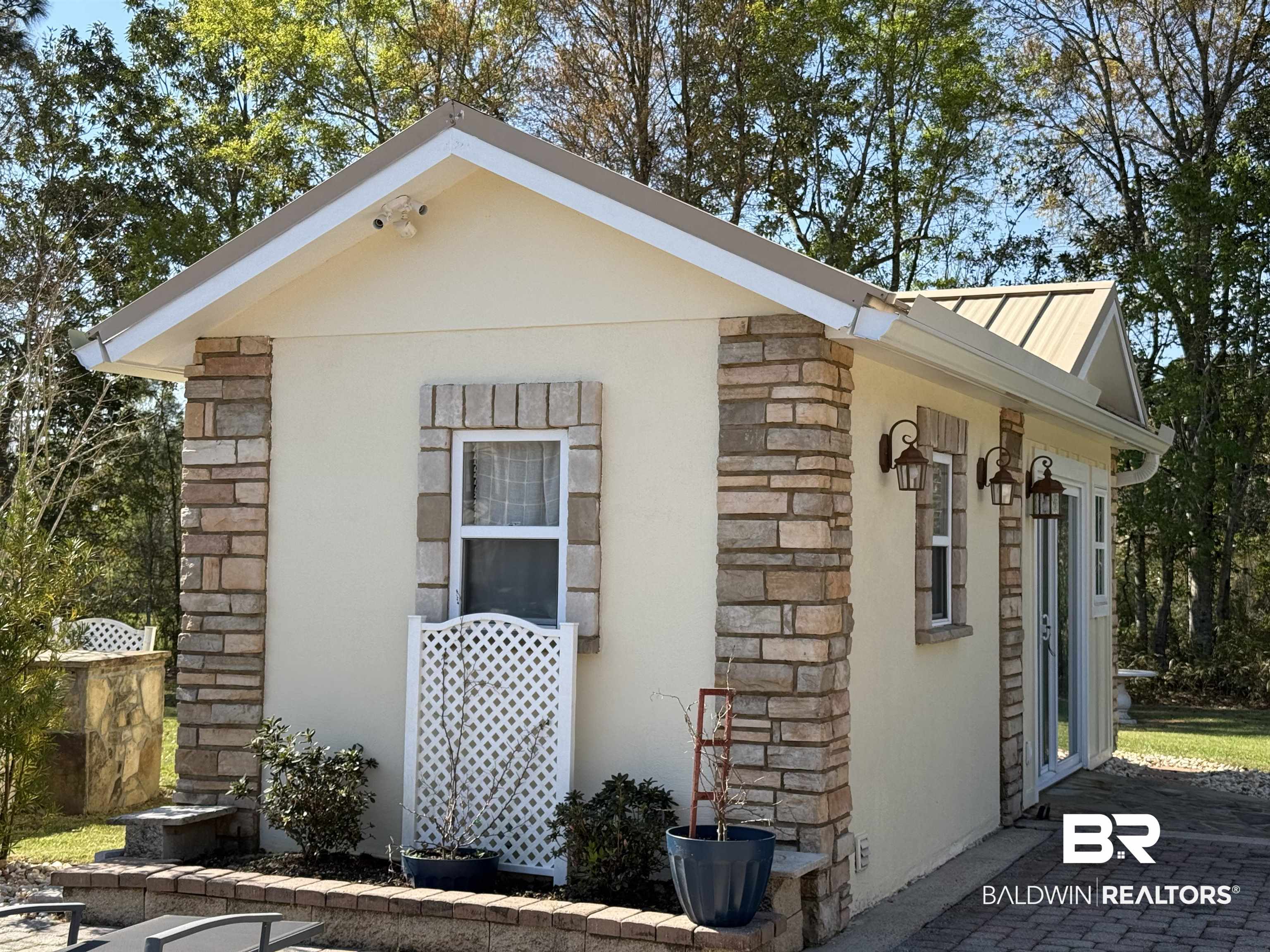 28114 Preserve Trail, Unit 190 Elberta, AL 36530 - Photo 1 of 69 View of home's exterior featuring stone siding, stucco siding, and a metal roof