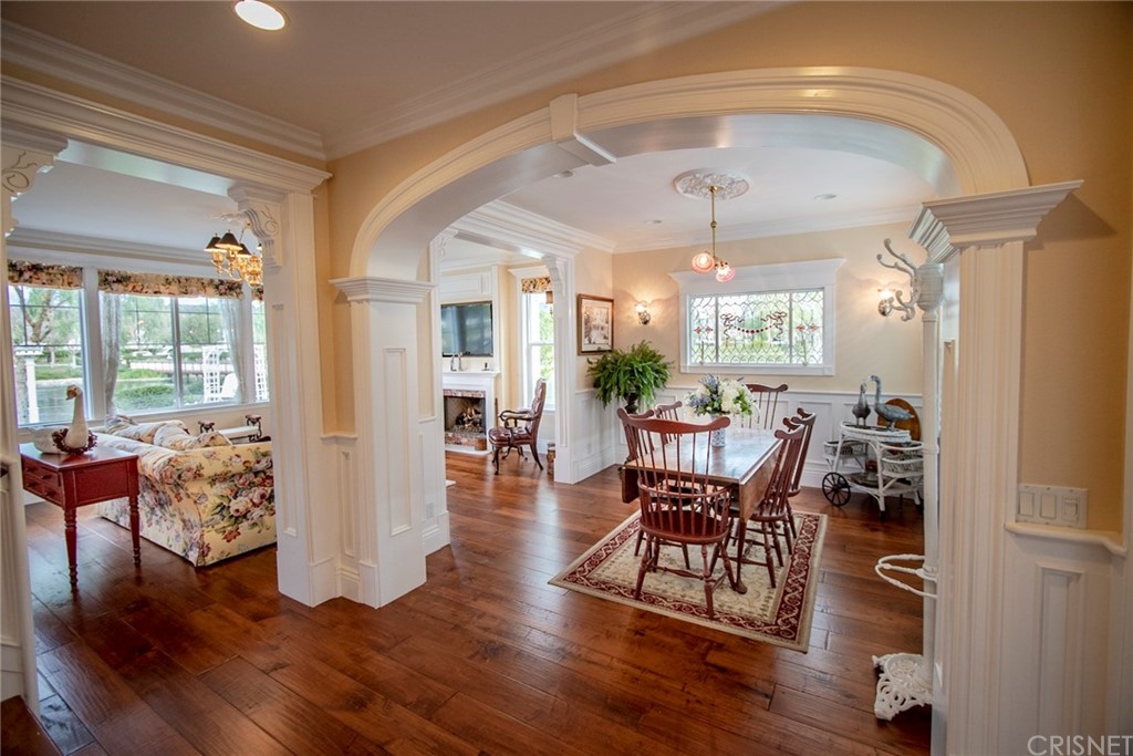 27016 Island Road Valencia, CA 91355 - Photo 11 of 53 a view of a dining room with furniture window and wooden floor