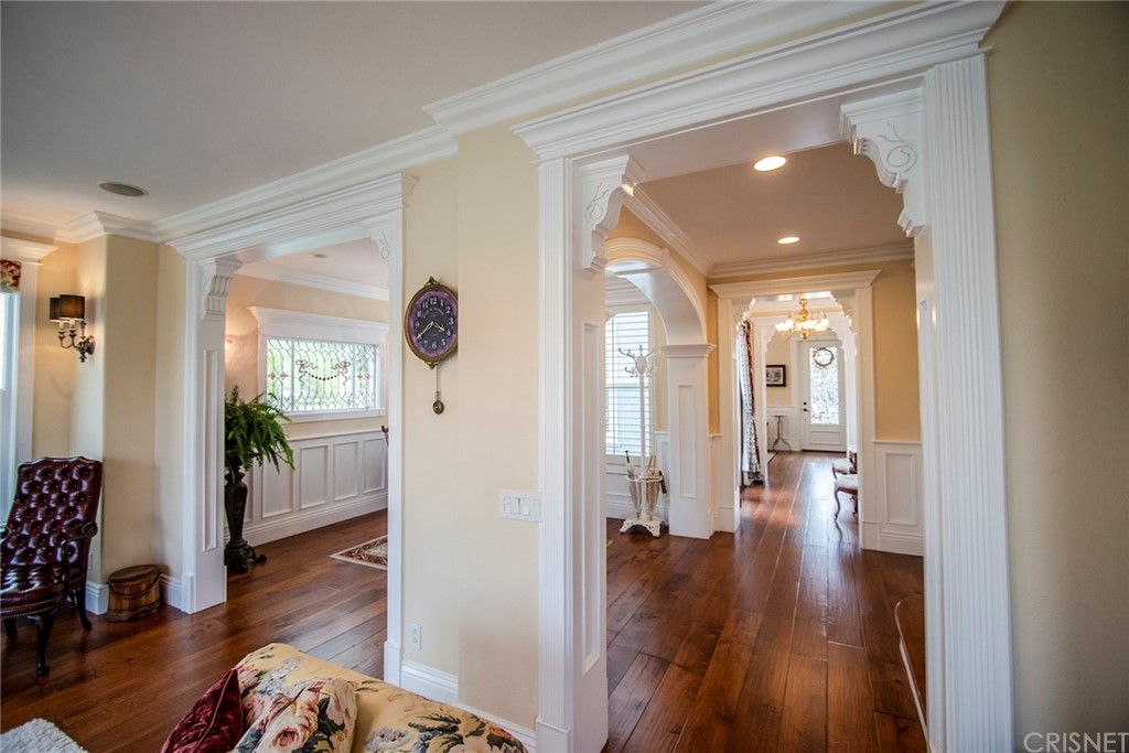 27016 Island Road Valencia, CA 91355 - Photo 15 of 53 a view of hallway with livingroom and wooden floor