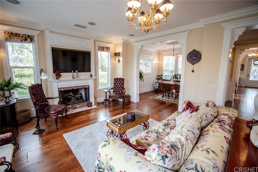 27016 Island Road Valencia, CA 91355 - Photo 16 of 53 a living room with furniture fireplace and a flat screen tv