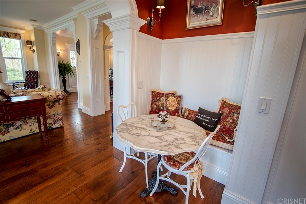 27016 Island Road Valencia, CA 91355 - Photo 19 of 53 a view of a dining room with furniture and wooden floor