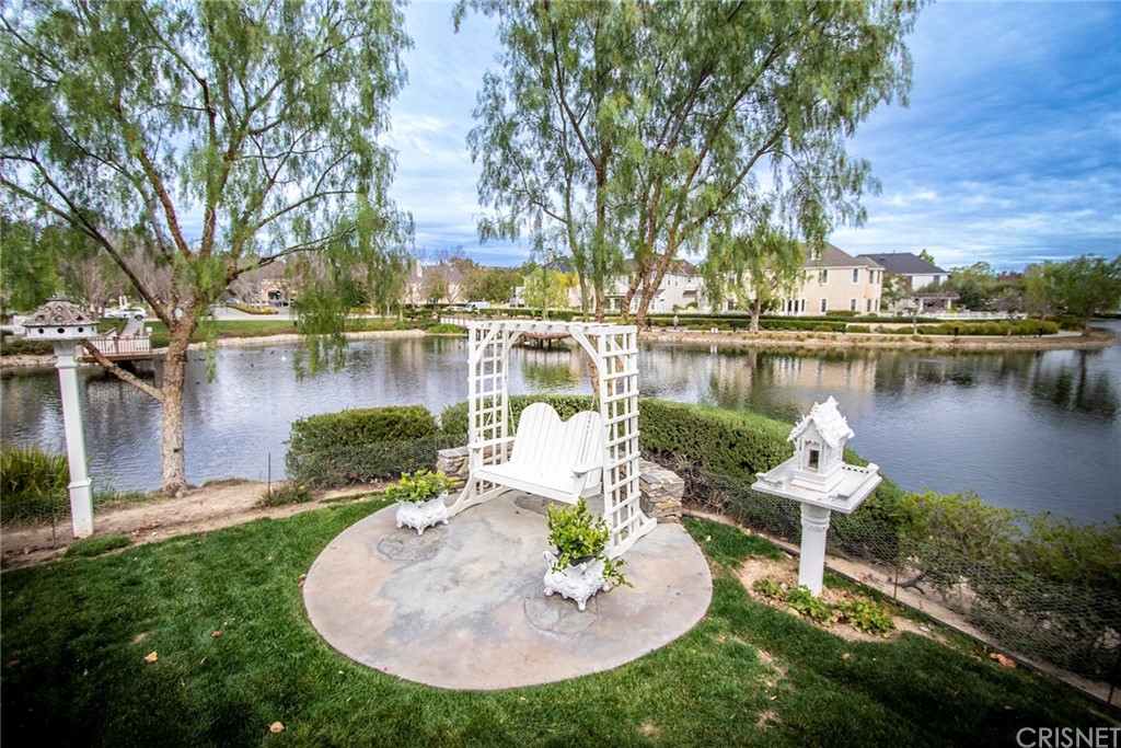 27016 Island Road Valencia, CA 91355 - Photo 26 of 53 a view of a lake with houses