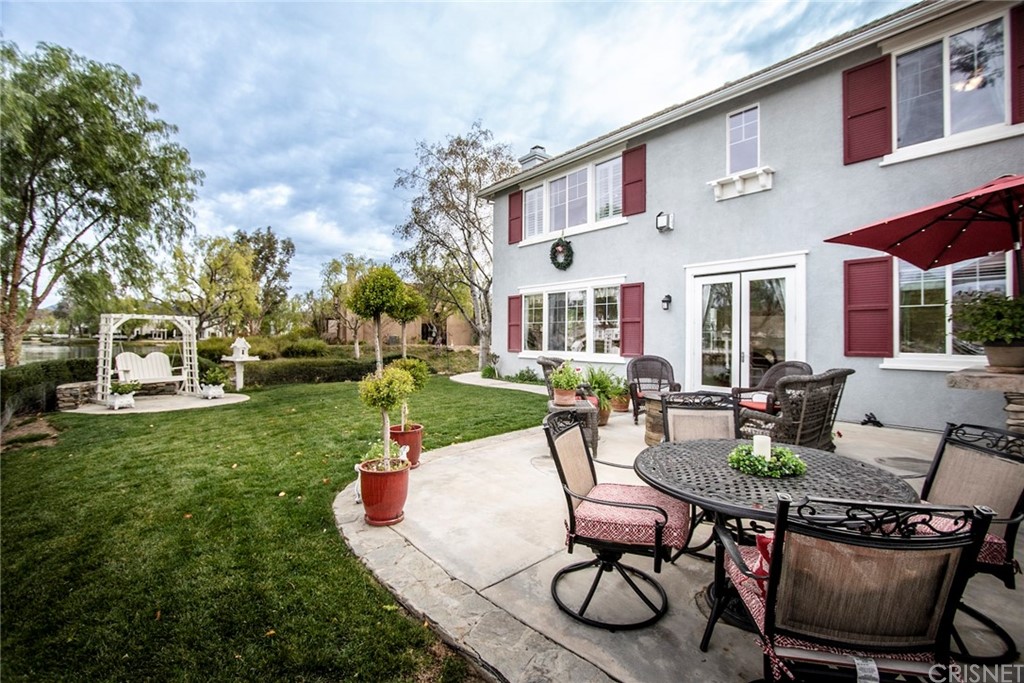 27016 Island Road Valencia, CA 91355 - Photo 30 of 53 a view of a patio with couches table and chairs