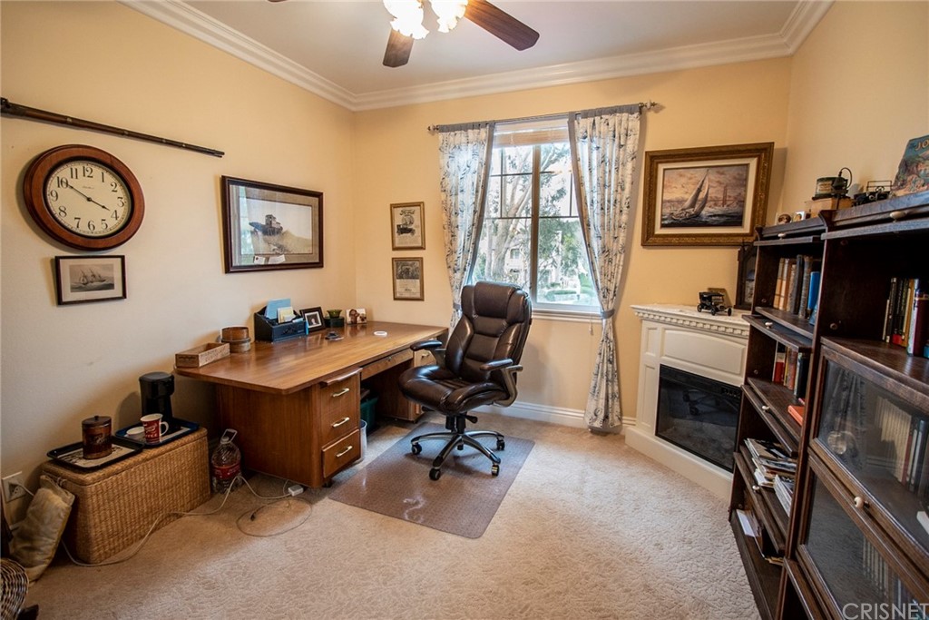 27016 Island Road Valencia, CA 91355 - Photo 34 of 53 a view of a workspace with furniture and a window