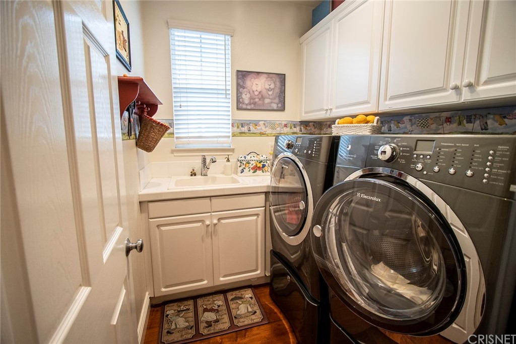 27016 Island Road Valencia, CA 91355 - Photo 35 of 53 a utility room with dryer and washer