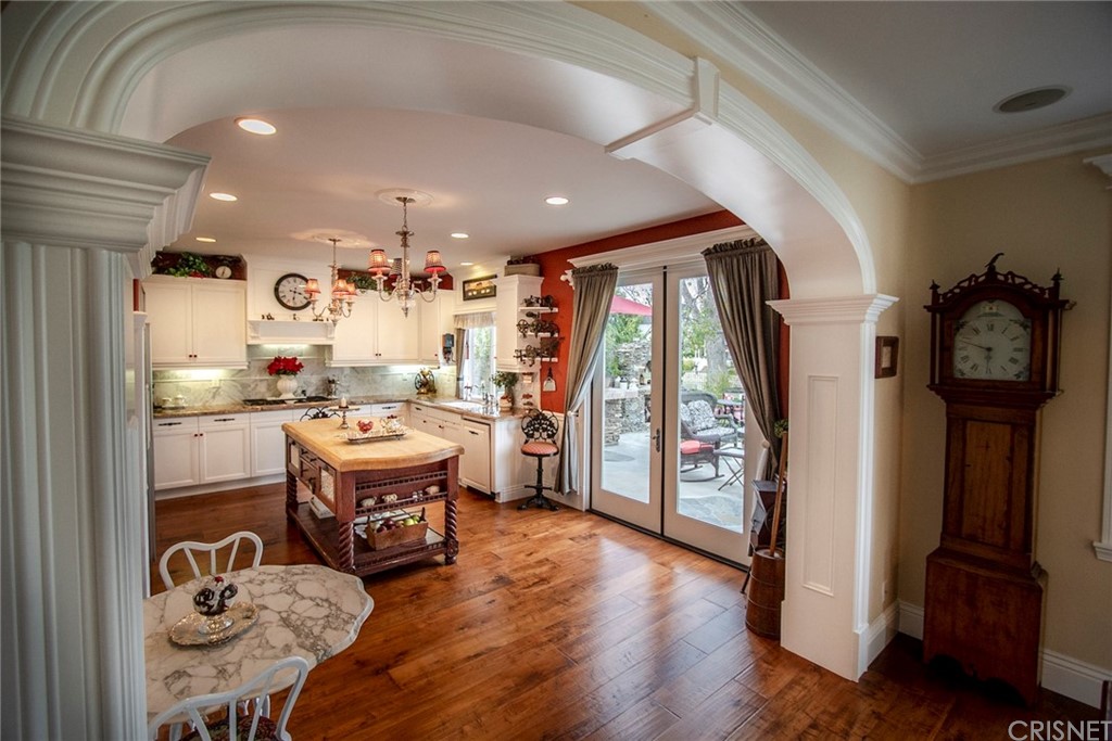 27016 Island Road Valencia, CA 91355 - Photo 4 of 53 a living room with furniture a large window and wooden floor