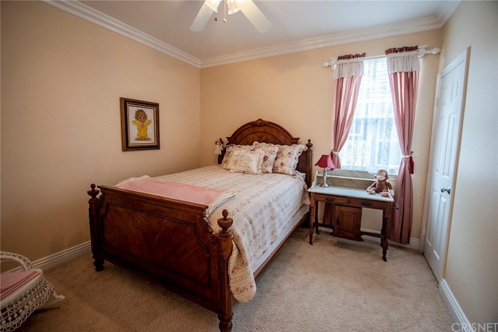 27016 Island Road Valencia, CA 91355 - Photo 41 of 53 a bed sitting in a bedroom next to a window