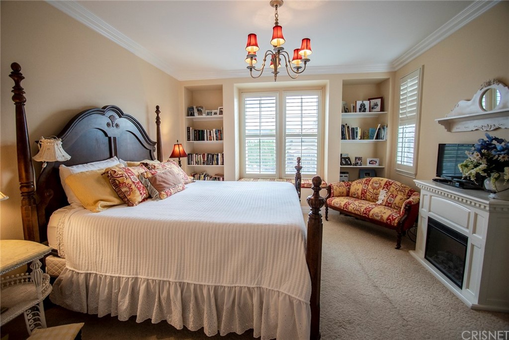 27016 Island Road Valencia, CA 91355 - Photo 44 of 53 a bedroom with a bed a couch and dresser