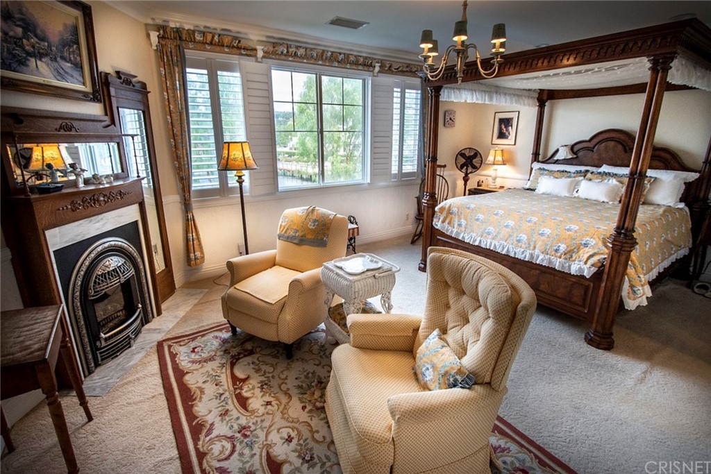 27016 Island Road Valencia, CA 91355 - Photo 45 of 53 a bedroom with furniture and a large window