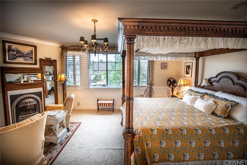 27016 Island Road Valencia, CA 91355 - Photo 46 of 53 a bedroom with a bed next to a large window with the outer view