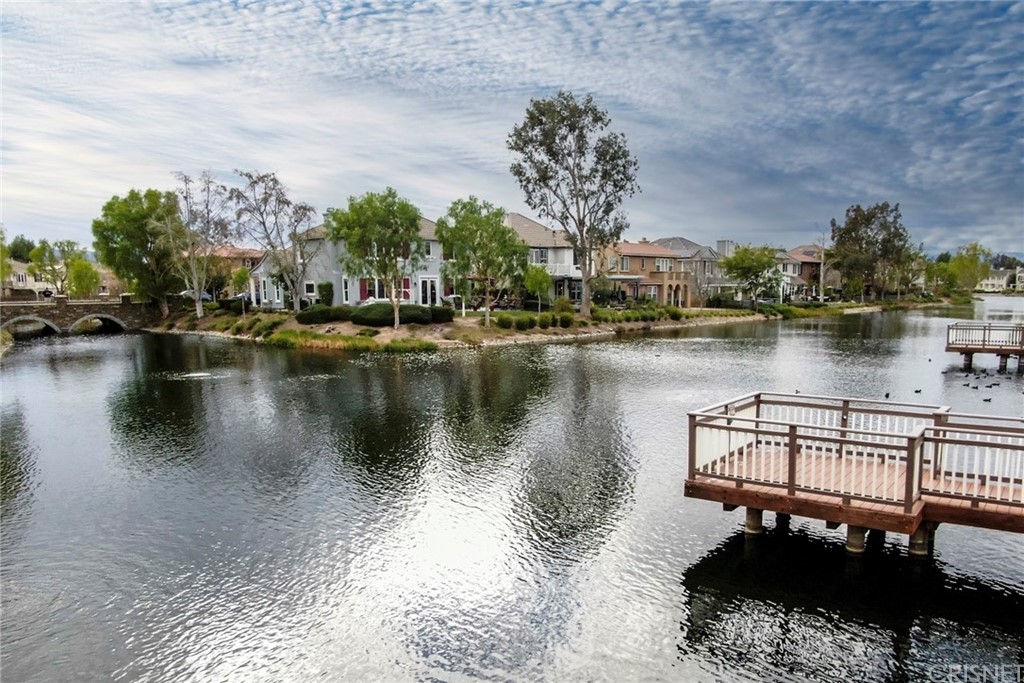 27016 Island Road Valencia, CA 91355 - Photo 53 of 53 a view of a lake with a house next to a lake
