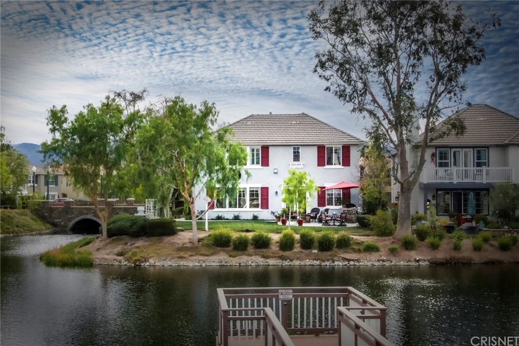 27016 Island Road Valencia, CA 91355 - Photo 6 of 53 a front view of a house with garden