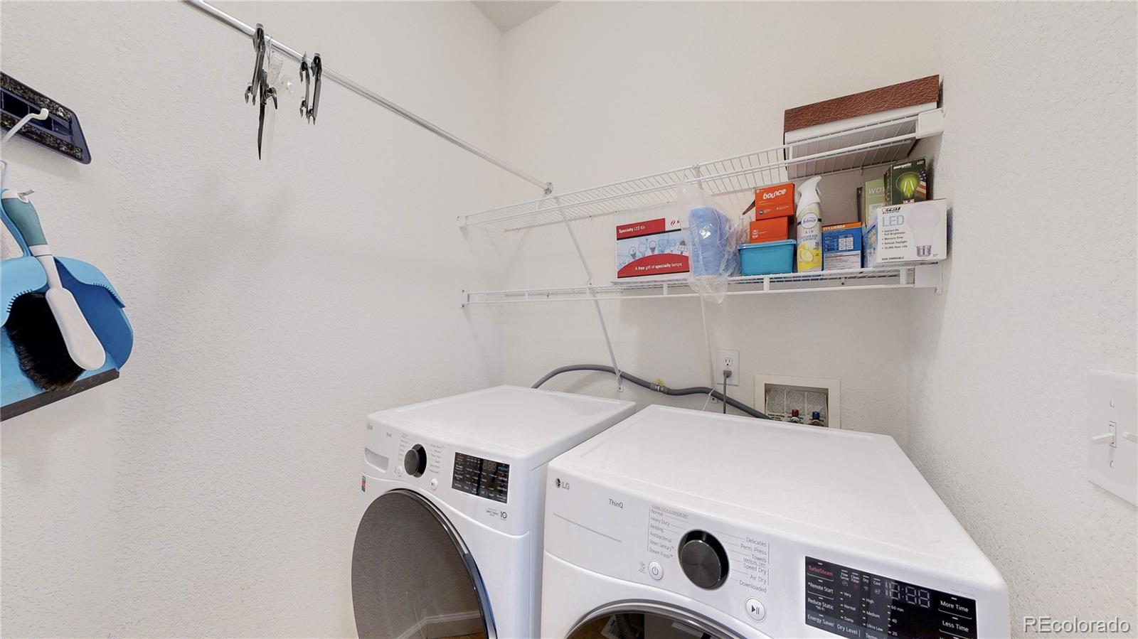 12237 Cook Court Thornton, CO 80241 - Photo 13 of 48 a utility room with dryer and washer
