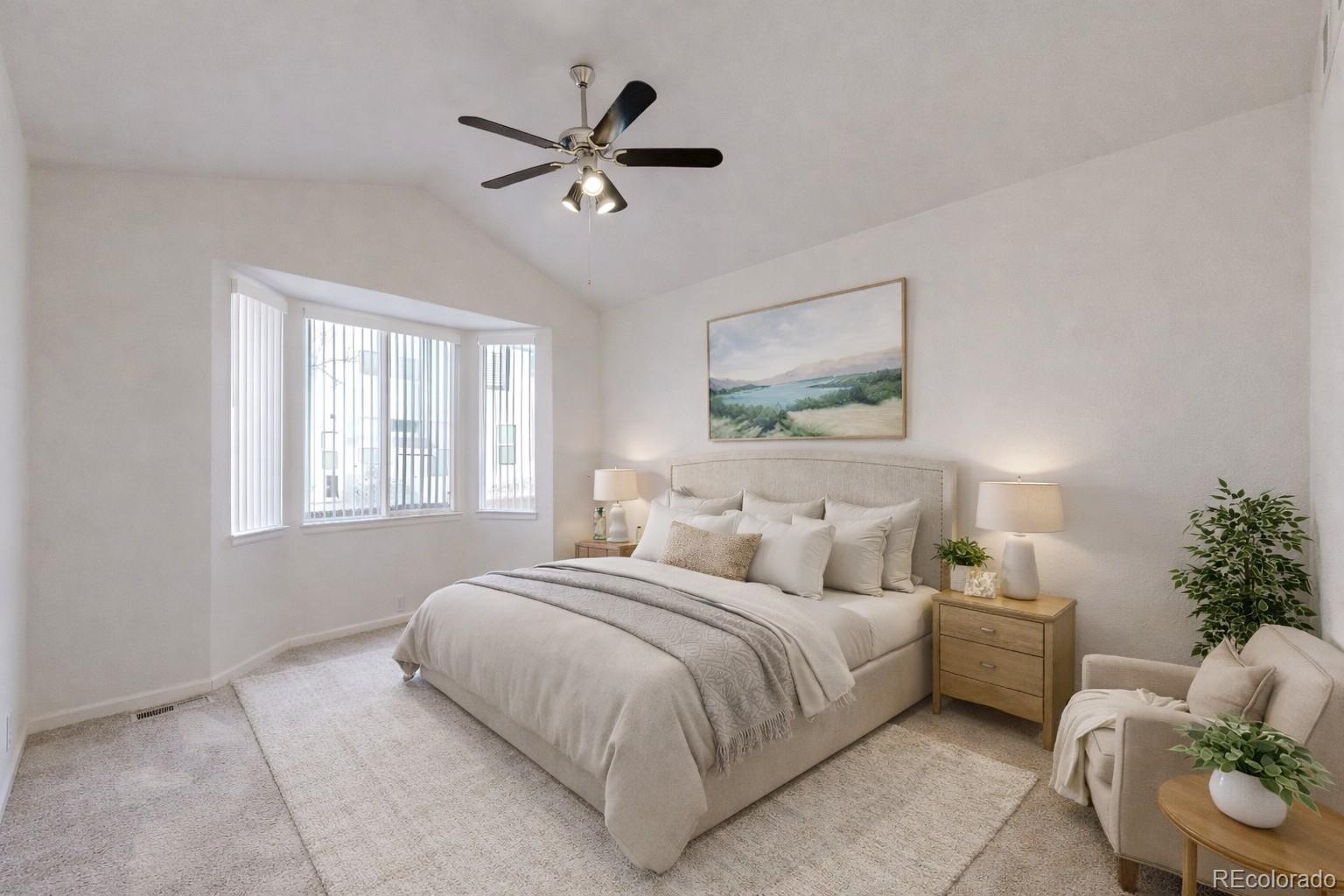 12237 Cook Court Thornton, CO 80241 - Photo 15 of 48 a bedroom with bed couch and window