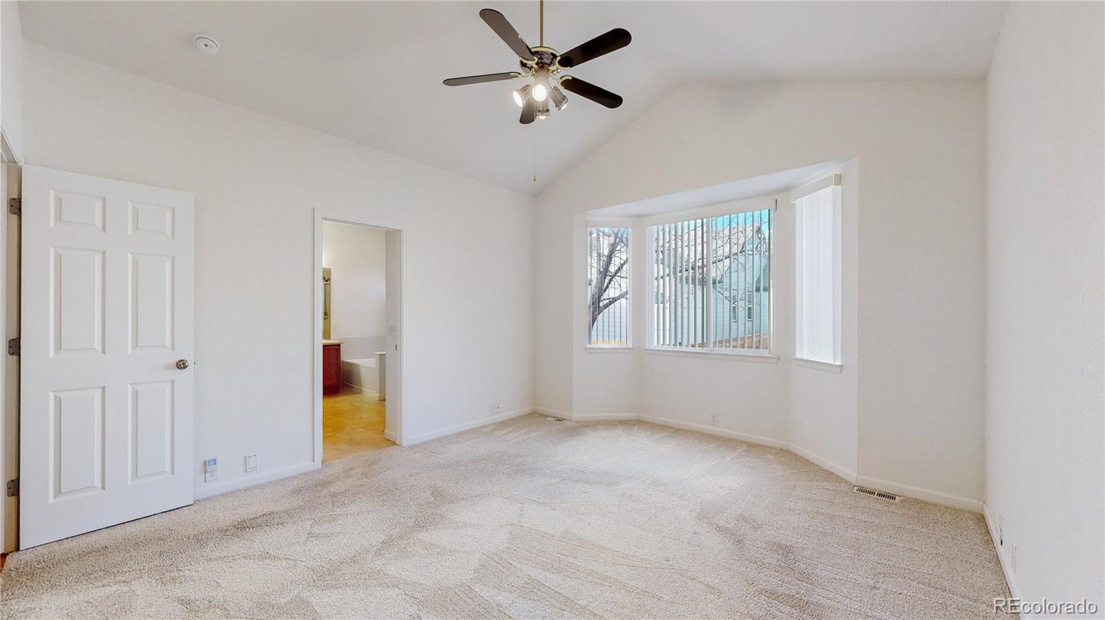 12237 Cook Court Thornton, CO 80241 - Photo 16 of 48 a view of an empty room with a window