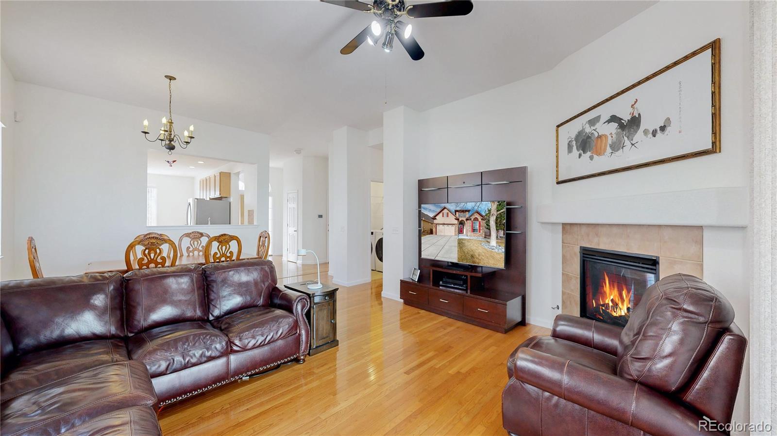12237 Cook Court Thornton, CO 80241 - Photo 2 of 48 a living room with furniture and a fireplace