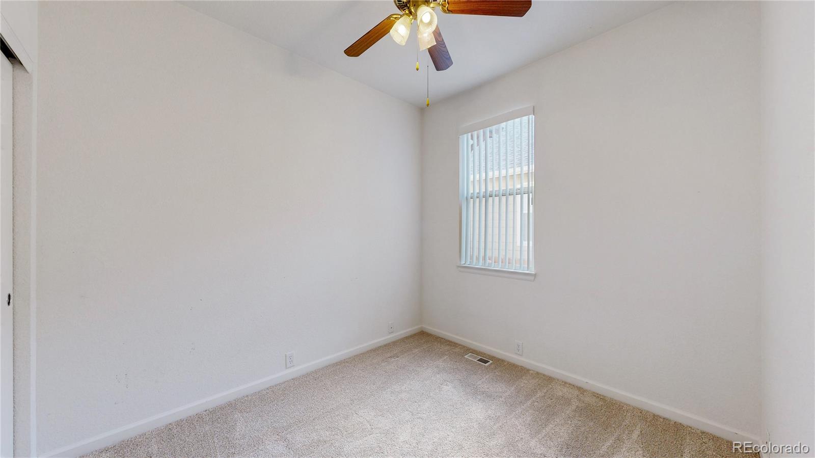 12237 Cook Court Thornton, CO 80241 - Photo 21 of 48 an empty room with a window