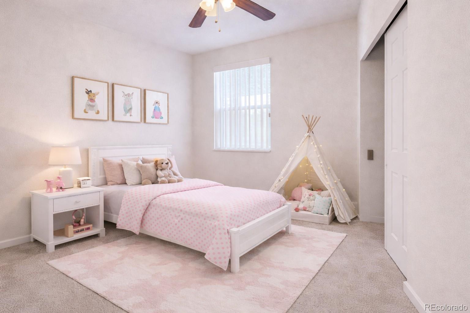 12237 Cook Court Thornton, CO 80241 - Photo 26 of 48 a bed room with a bed and a chandelier